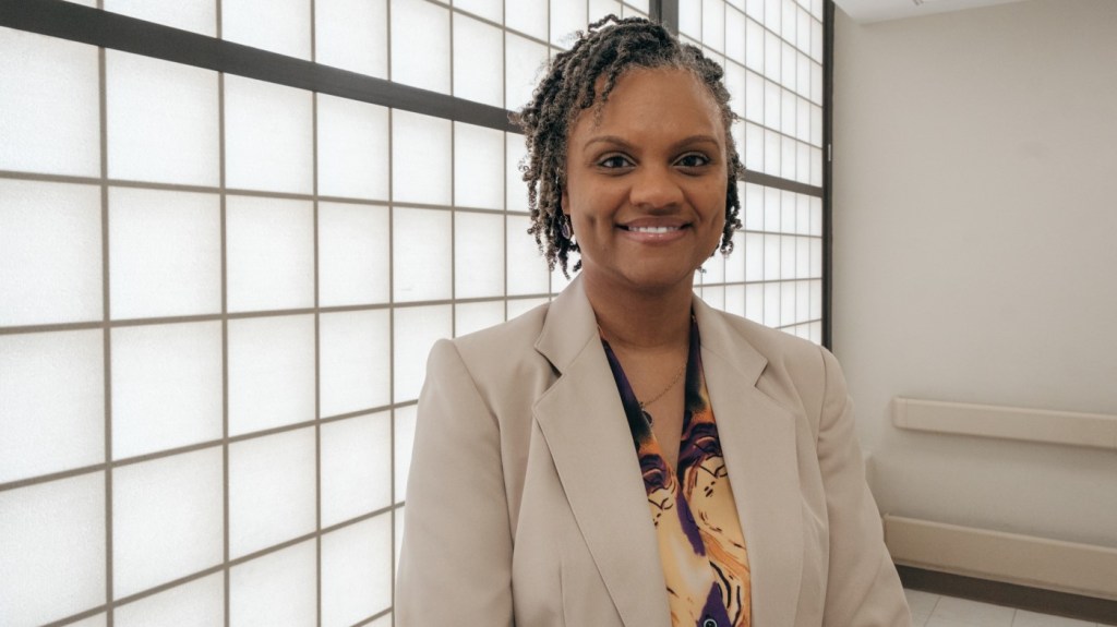A VA human resources (HR) specialist in a hallway inside a VA facility.