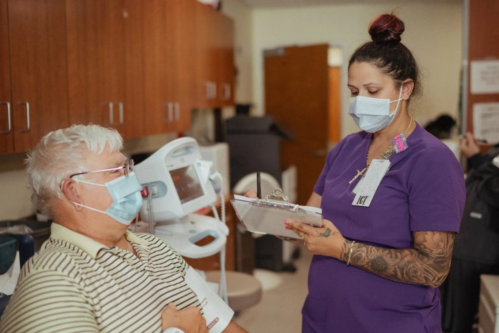 ICT nursing checking on a patient