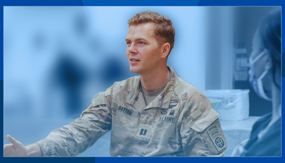 Seated man in Army uniform engages in a discussion.