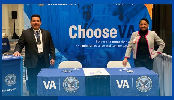 Two VA recruiters attend an event.