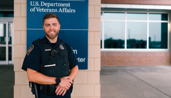 A VA Police officer stands outside a VA facility, one of many first responders employed by VA.