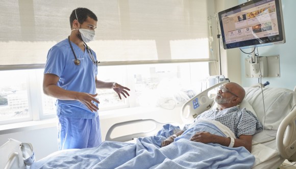 VA physician discusses gastroenterology concerns with a patient.