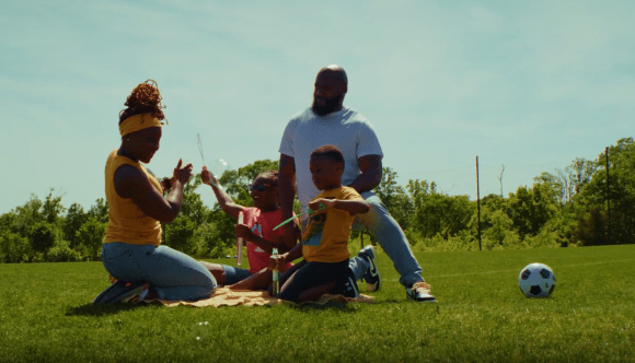 A Veteran and her military spouse enjoying time with their family.