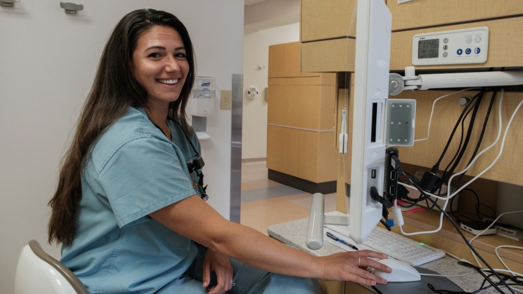 A VA employee working at a computer. 